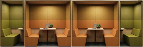 Vier open treincabines op een rij. Aan weerszijden staan tweepersoons stiltewerkplekken in het groen. In het midden zien we twee oranje akoestische werkplekken voor vier personen. Samen vormen deze twee de akoestische werkplek voor 8 personen.
